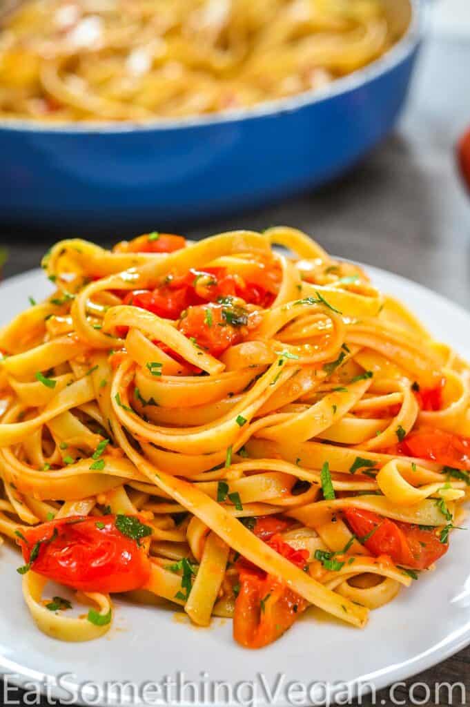 fettuccine in tomato sauce on a white plate