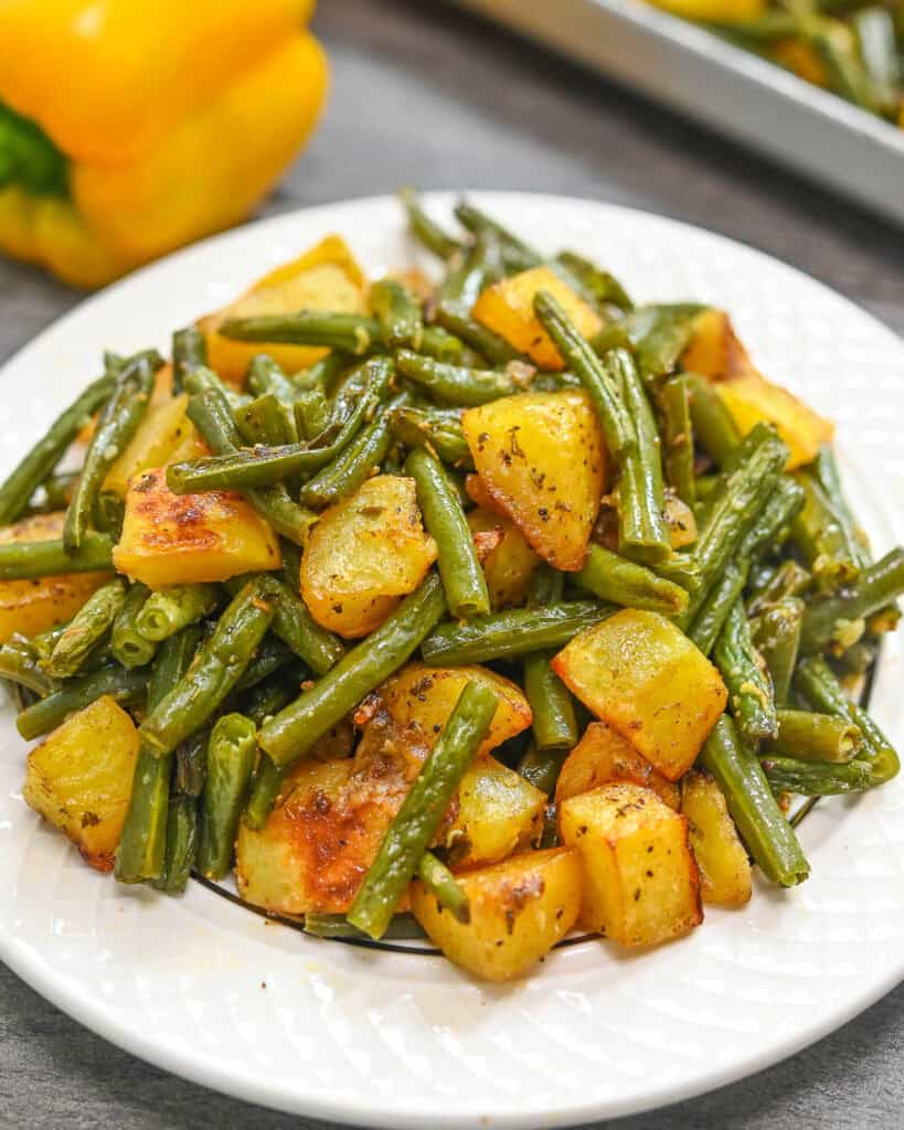 roasted potatoes with green beans on a plate