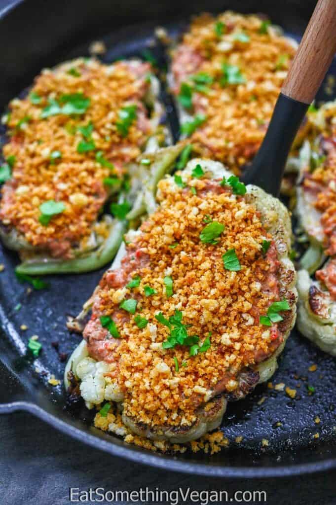 Cauliflower Steaks with Roasted Pepper Sauce on a spatula