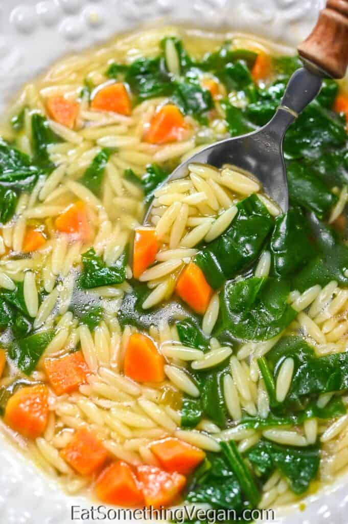 Spinach Orzo Soup on a spoon