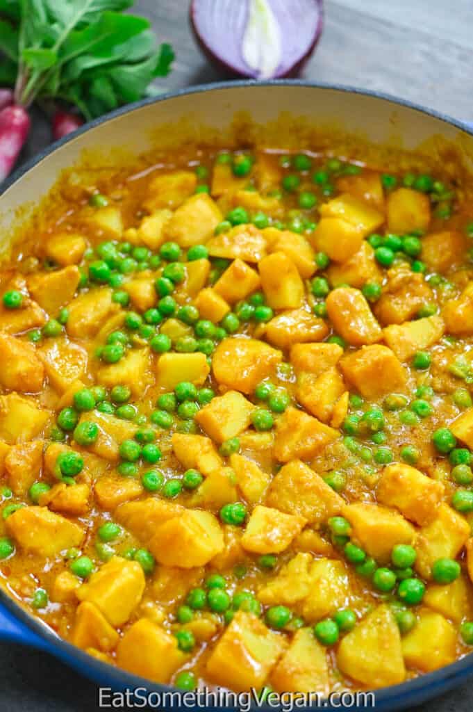 Potato Curry with Peas in a skillet