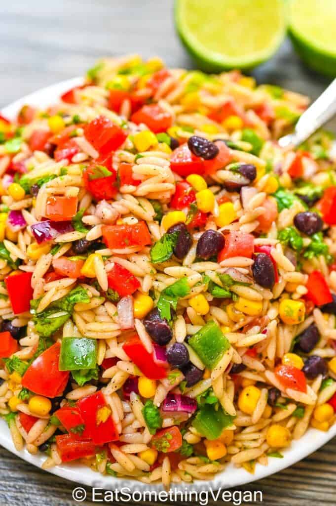 Summer Orzo Salad on a plate with a fork