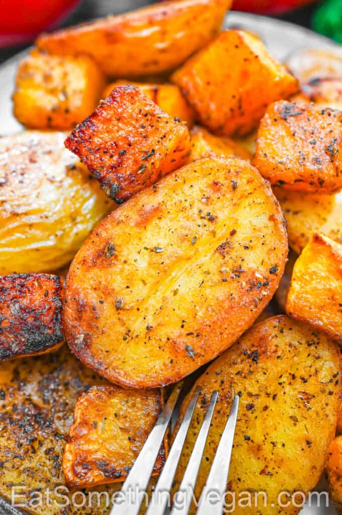 Baked Potatoes and Butternut Squash served on a plate