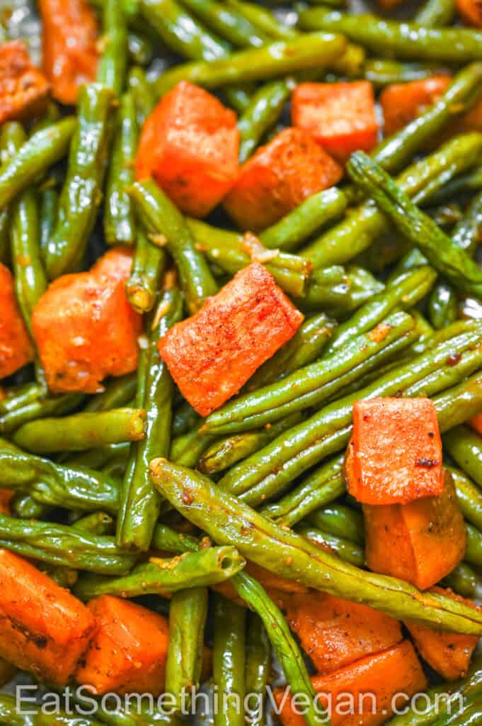 Sweet Potatoes and Green Beans on a baking sheet, close-up