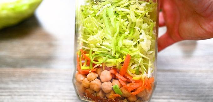 Layered vegetables and chickpeas in a jar