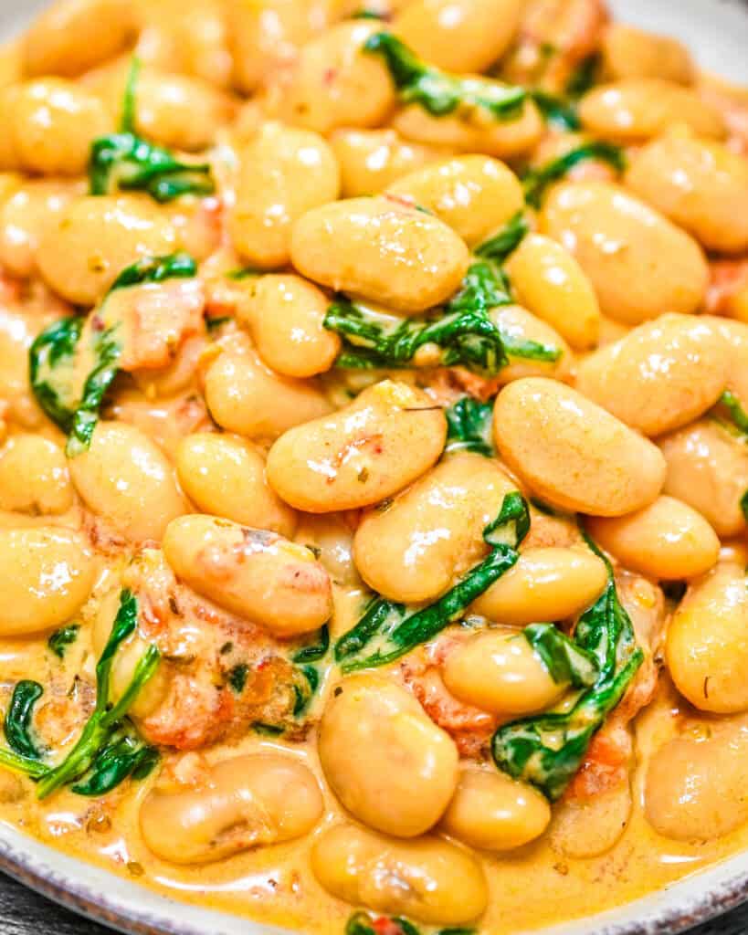 Creamy tomato white beans served on a plate