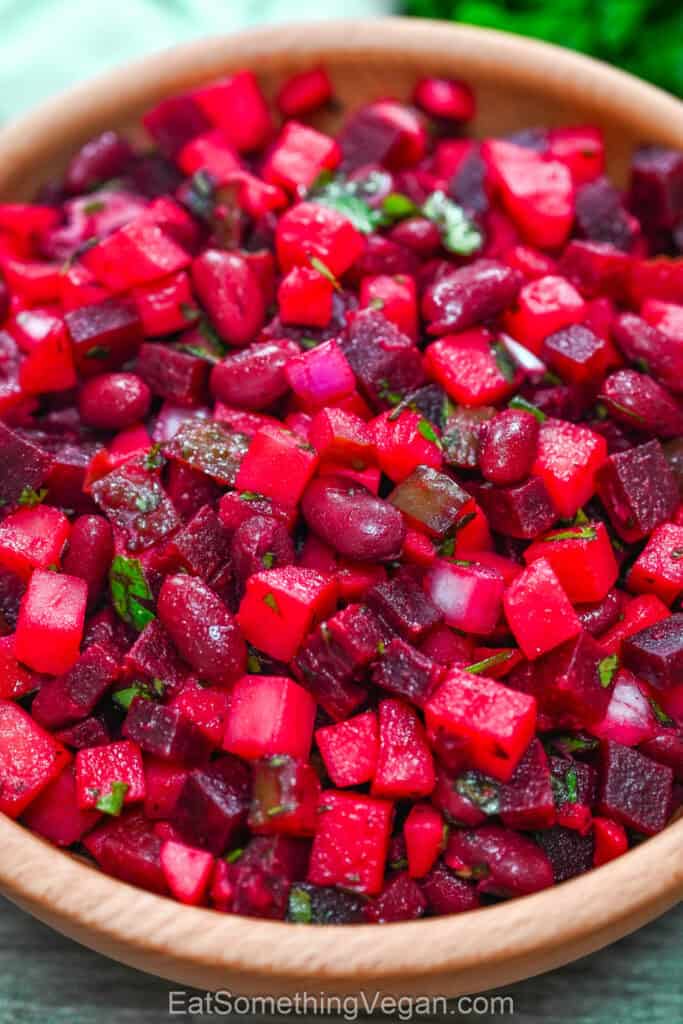 Close-up of beet and bean salad in a wooden bowl