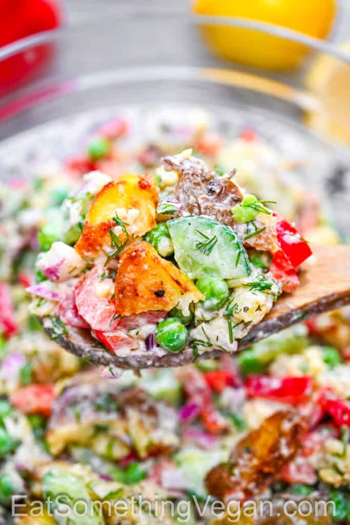 Spoonful of creamy smashed potato salad