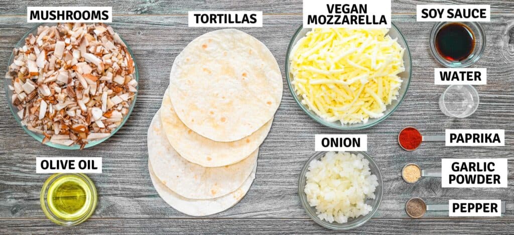 Ingredients for mushroom tacos on a wooden table