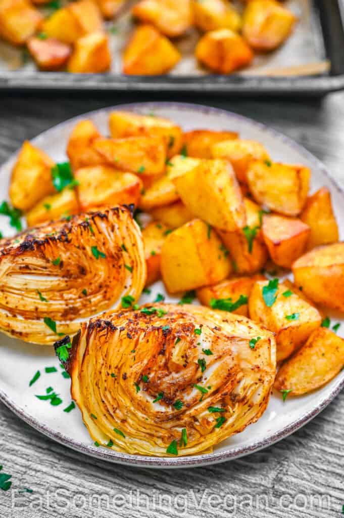 Roasted cabbage and potatoes served on a plate