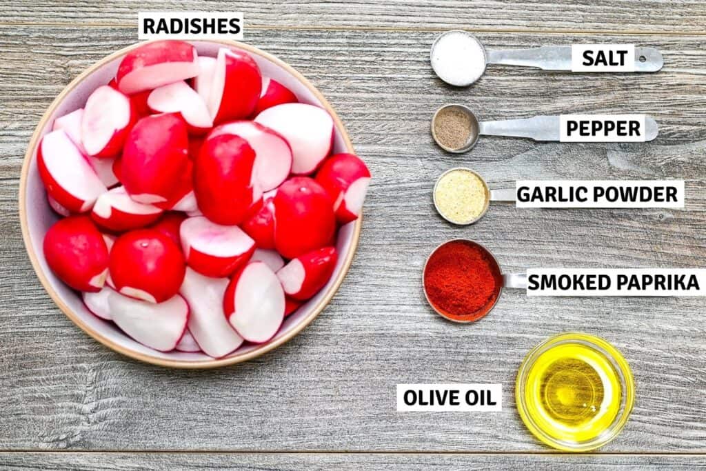Ingredients for roasted radishes on a wooden table.