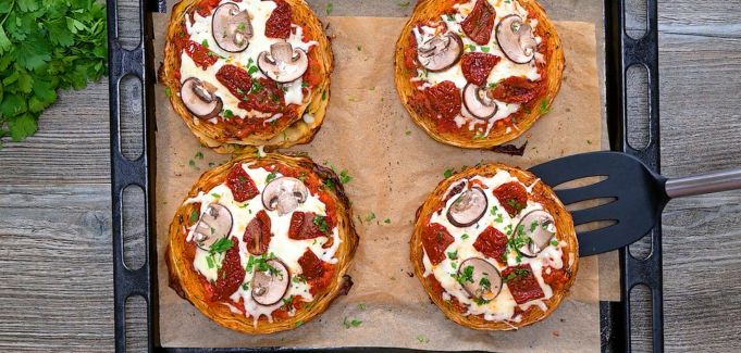 Baked cabbage pizza steaks with melted cheese and toppings