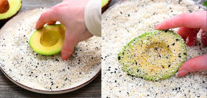 Coating avocado with panko breadcrumbs and everything bagel seasoning