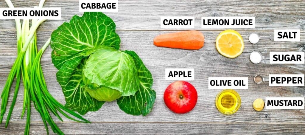 Fresh ingredients arranged on a table for a cabbage salad
