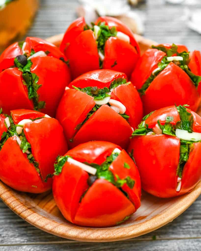 garlic marinated tomatoes stuffed with parsley and garlic on a plate