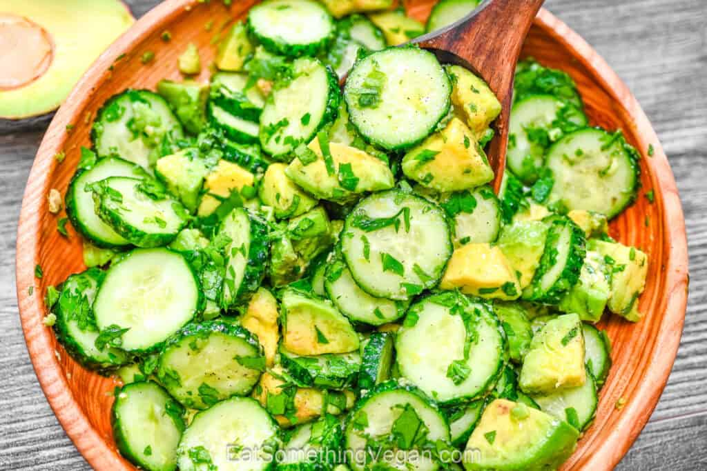 Fresh salad with cucumbers and avocado in a bowl