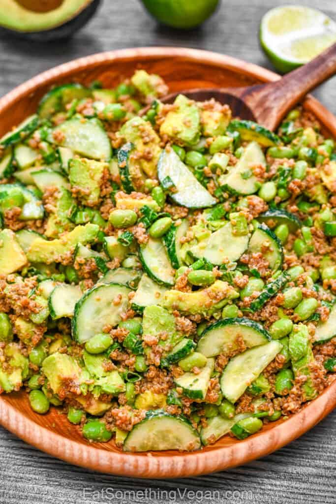 Crispy quinoa salad with avocado, cucumber, and edamame in a bowl