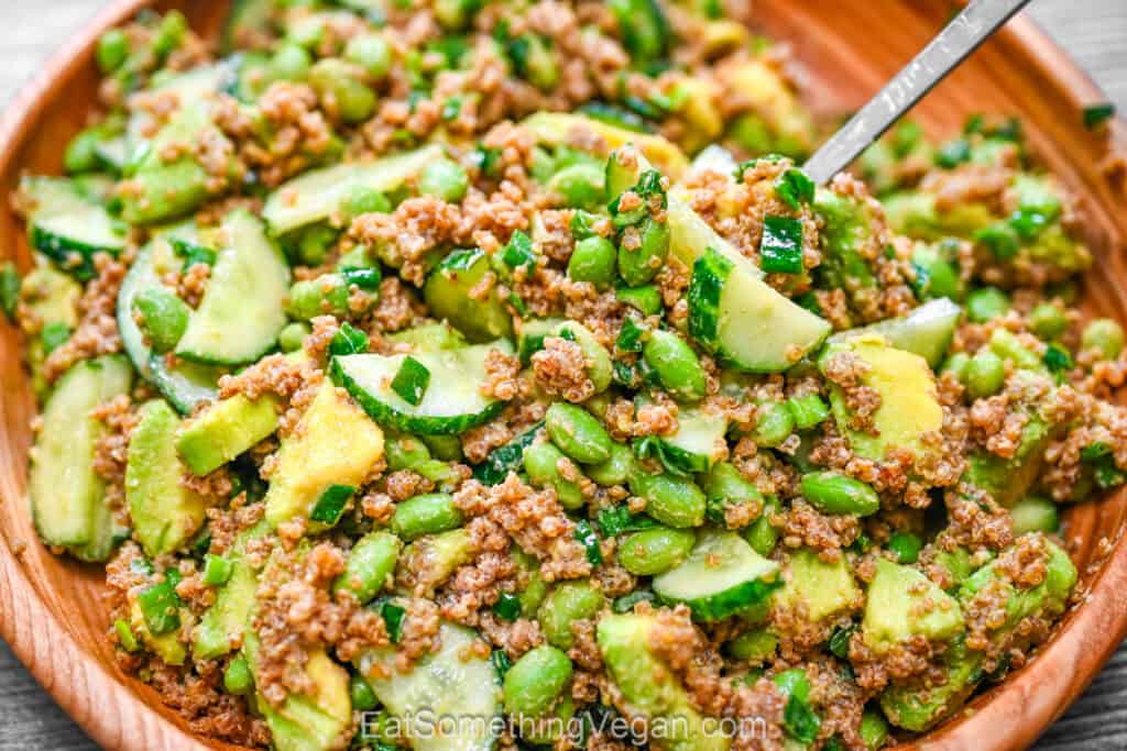 Crispy quinoa salad with avocado, cucumber, and edamame close-up