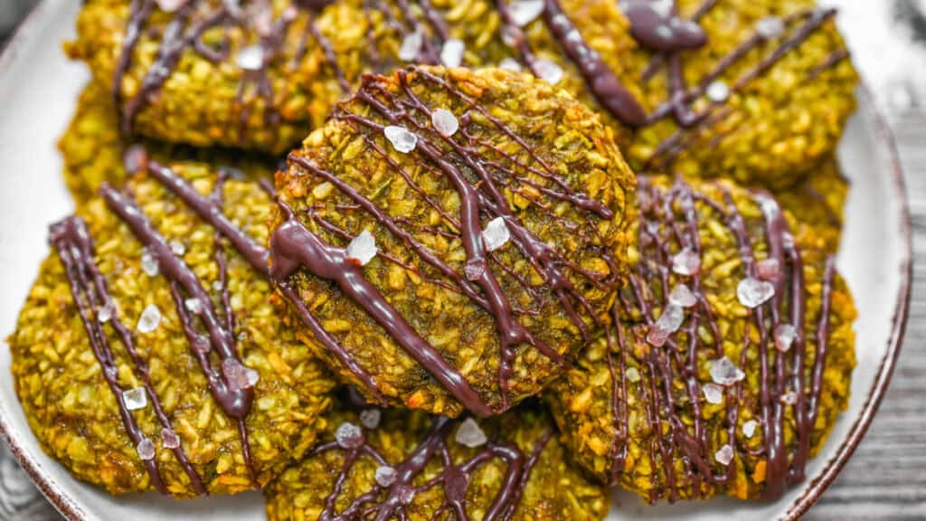 Healthy vegan matcha coconut cookies with dark chocolate drizzle and coarse sea salt.