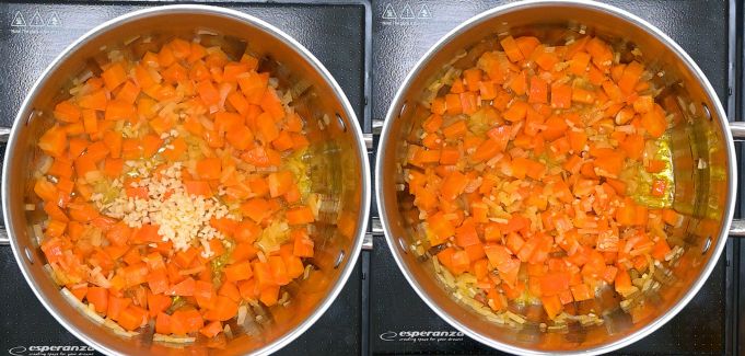 Adding minced garlic to the sautéed vegetables in a pot.