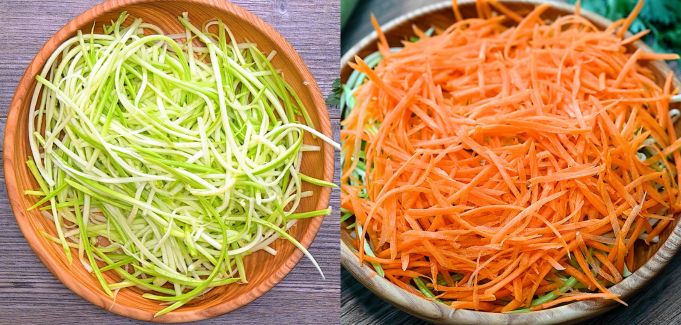 Zucchini and carrots julienned into thin strips.