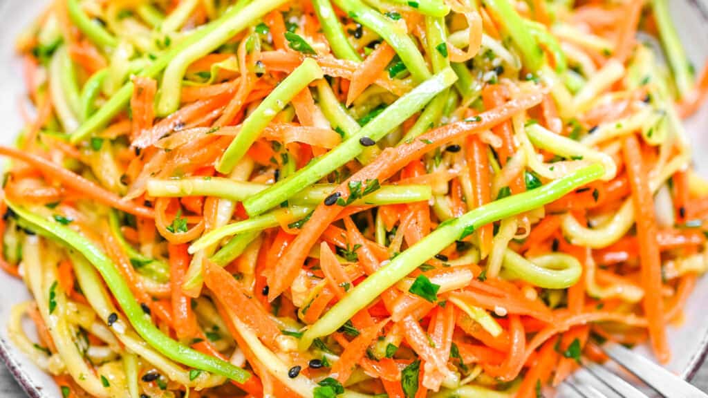 Crispy Korean-style zucchini and carrot salad on a plate.