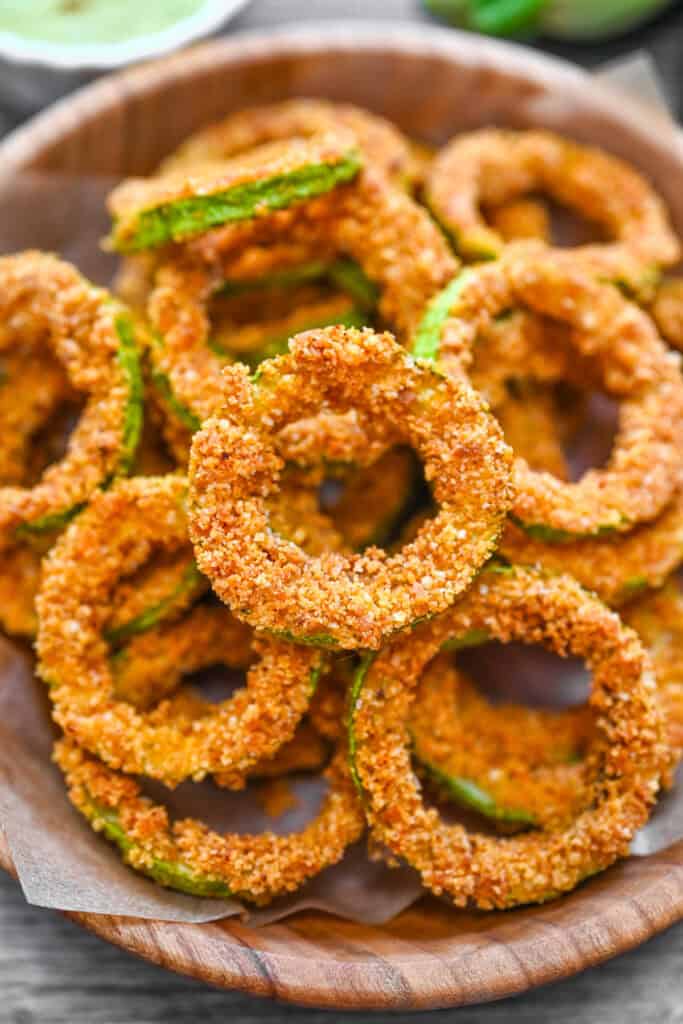 Crispy Zucchini Rings served in a wooden bowl.