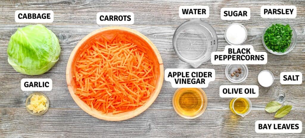Ingredients for quick pickled cabbage rolls with text labels, including cabbage, carrots, garlic, herbs, and pickling spices on a wooden background