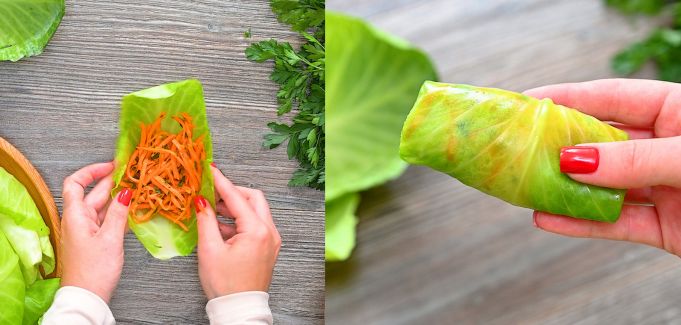 Placing seasoned shredded carrots onto a softened cabbage leaf and rolling it tightly into a roll