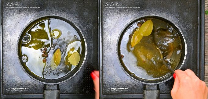 Simmering pickling brine with bay leaves and peppercorns in a saucepan on an induction stovetop