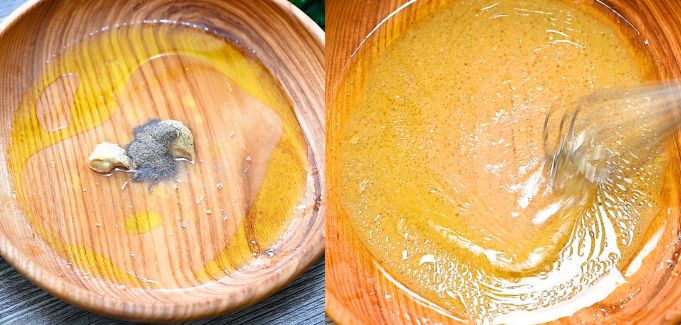 Whisking maple-Dijon vinaigrette in a wooden bowl.