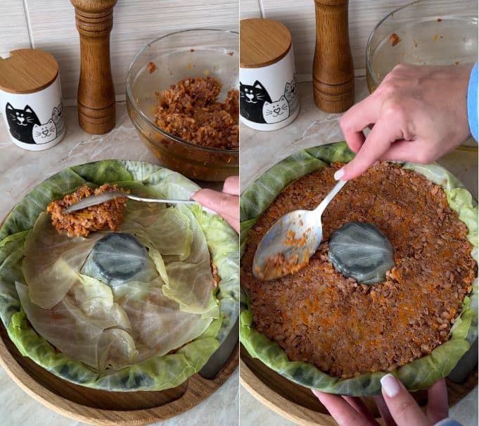 Adding a middle layer of cabbage leaves and spreading the remaining filling on top.