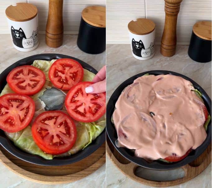 Topping the cabbage cake with tomato slices and spreading creamy tomato sauce on top.