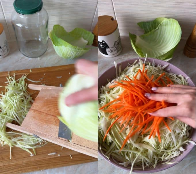 Shredding white cabbage on a wooden mandoline slicer and adding julienned carrots to a large mixing bowl.
