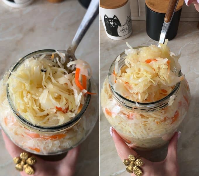 Tasting a forkful of crunchy homemade sauerkraut from the jar to check crispness and tangy flavor.