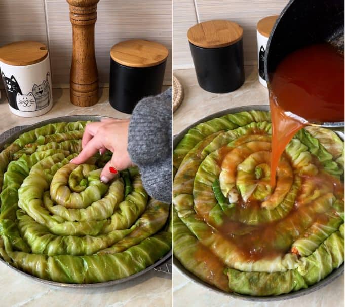 Pouring hot seasoned tomato broth evenly over the assembled cabbage spiral in a baking pan before baking.