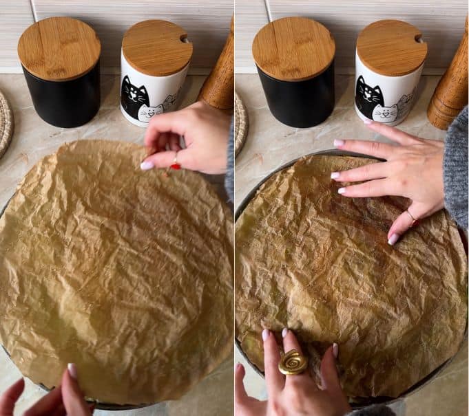 Covering the spiral cabbage rolls with a sheet of damp crumpled parchment paper before baking in the oven.
